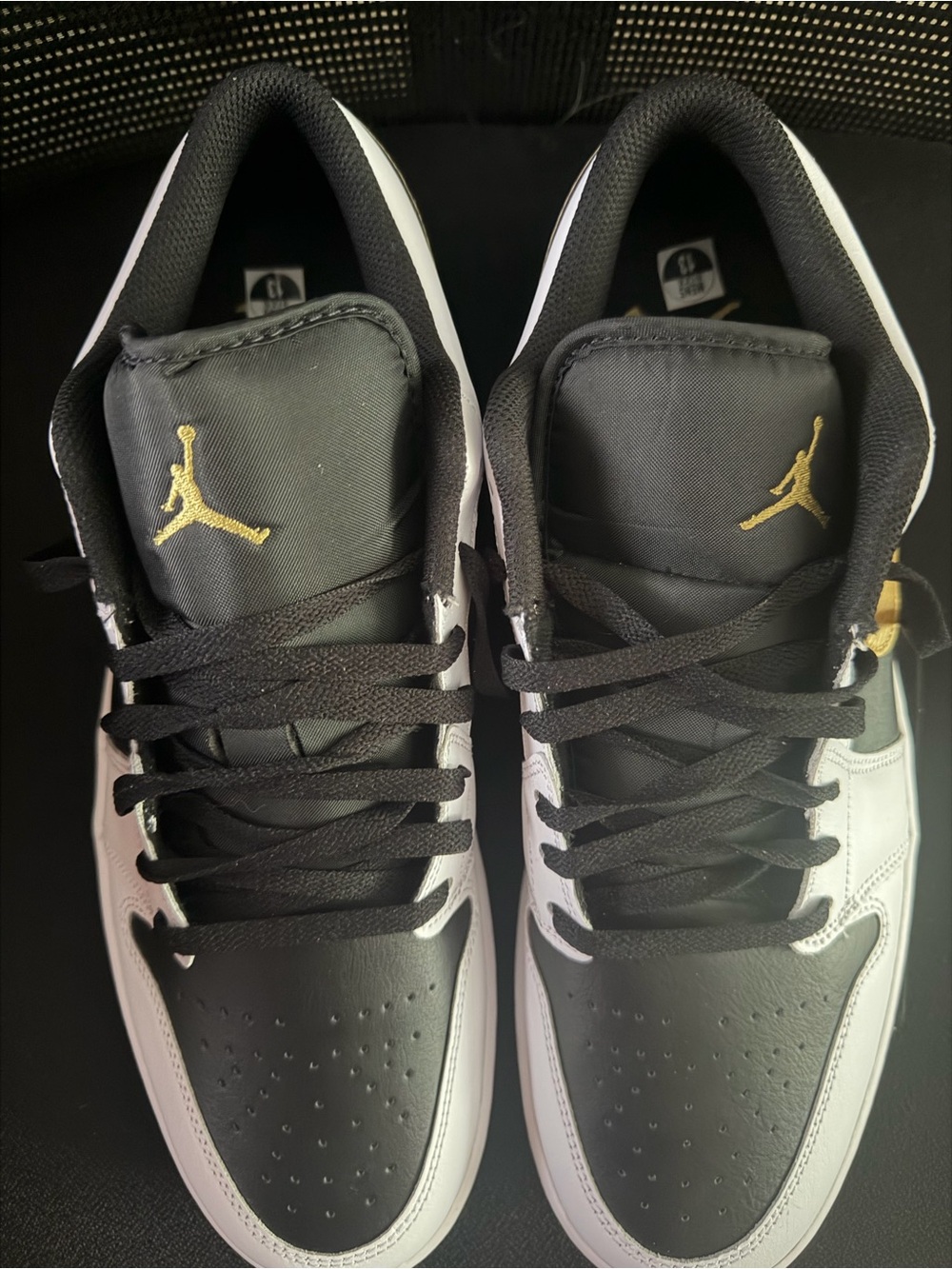 Nike Air Jordan White and Black Sneakers with Gold Swoosh